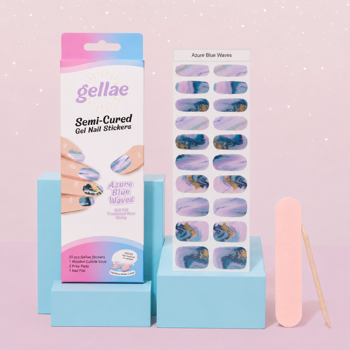 Gellae Semi-Cured Gel Nail Stickers in 'Azure Blue Waves' set, featuring the retail box, a sheet of decorative nail stickers, a pink nail file, and a wooden stick on light blue display blocks against a pink background.