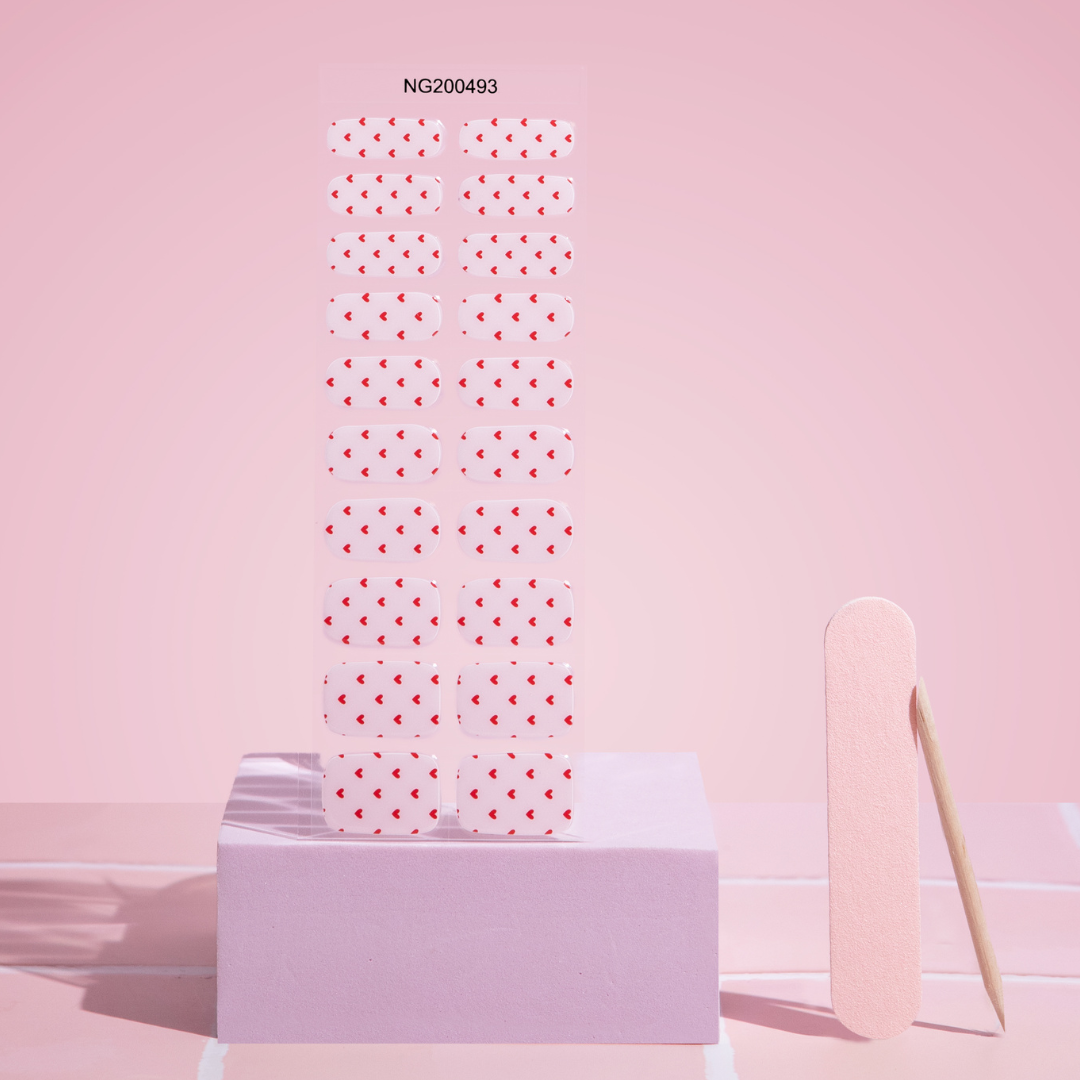 Gellae Polka dot paper towel roll with a popsicle on a pink background